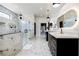 Sleek bathroom with marble walls, glass shower, and modern vanity offers an elegant and functional design at 1812 Hunters Gln, Marietta, GA 30062