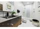 Modern bathroom featuring a glass-enclosed shower, a black marble countertop, and sleek fixtures at 1812 Hunters Gln, Marietta, GA 30062