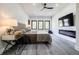 Modern bedroom with a fireplace and television, featuring attractive wood flooring and view outside at 1812 Hunters Gln, Marietta, GA 30062