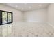 Large bonus room featuring marble floors and a sliding glass door to the backyard at 1812 Hunters Gln, Marietta, GA 30062
