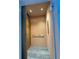 Residential elevator featuring custom wood-paneled interior and sleek metal accents at 1812 Hunters Gln, Marietta, GA 30062