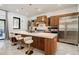 Bright kitchen with stainless steel appliances and a large center island with bar seating at 1812 Hunters Gln, Marietta, GA 30062