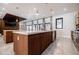 Open kitchen with eat-in island and modern cabinets in a brightly lit space at 1812 Hunters Gln, Marietta, GA 30062