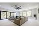 Spacious living room with large windows offering a view of nature and cozy seating arrangement at 1812 Hunters Gln, Marietta, GA 30062