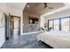 Modern bedroom with sleek wooden accent wall, TV, and balcony access for seamless indoor-outdoor living at 1812 Hunters Gln, Marietta, GA 30062