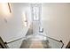 Bright staircase with glass railings and modern lighting fixture, with a view to another level at 1812 Hunters Gln, Marietta, GA 30062