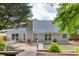 View of the backyard with wooden deck, gray siding, and landscaped yard at 2420 Walnut Grove Way, Suwanee, GA 30024