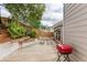 Backyard patio perfect for outdoor dining featuring a grill and landscaped planters at 2420 Walnut Grove Way, Suwanee, GA 30024