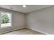 Cozy bedroom featuring a bright window with views of the outdoors at 2420 Walnut Grove Way, Suwanee, GA 30024