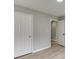 Bedroom showing multiple doors and light gray walls, complete with wood-look flooring at 2420 Walnut Grove Way, Suwanee, GA 30024