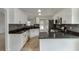 Spacious kitchen view with stainless appliances and black countertops at 2420 Walnut Grove Way, Suwanee, GA 30024