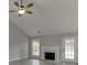The living room features a fireplace, ceiling fan, backyard windows, and natural light at 2420 Walnut Grove Way, Suwanee, GA 30024