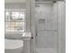 Bathroom showcasing a glass enclosed shower, bathtub, and window at 2420 Walnut Grove Way, Suwanee, GA 30024