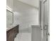 Main bathroom featuring a double sink vanity with granite countertops and a walk-in shower at 2420 Walnut Grove Way, Suwanee, GA 30024