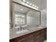 Bathroom with granite countertops, double sinks, large mirror, and garden view at 2420 Walnut Grove Way, Suwanee, GA 30024