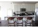 Modern kitchen with a sleek island, stainless steel appliances, and stylish bar stools at 711 Cosmopolitan Dr # 413, Atlanta, GA 30324