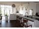 Open-concept living space with comfortable seating, modern kitchen, and access to a balcony at 711 Cosmopolitan Dr # 413, Atlanta, GA 30324