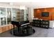 Beautifully designed piano room with a grand piano, stylish console table, and comfortable seating area at 711 Cosmopolitan Dr # 413, Atlanta, GA 30324