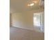 Bedroom showcasing neutral colored walls and plush carpeting at 1336 Nathan Mauldin Dr, Lawrenceville, GA 30043