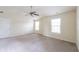 Spacious bedroom with neutral carpeting and a ceiling fan provides comfort at 1336 Nathan Mauldin Dr, Lawrenceville, GA 30043