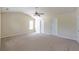 This bedroom offers ample space, natural light, and neutral carpeting at 1336 Nathan Mauldin Dr, Lawrenceville, GA 30043