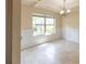 Dining room with natural light from the large window and crown molding at 1336 Nathan Mauldin Dr, Lawrenceville, GA 30043