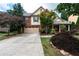 Charming two-story home featuring a brick facade, covered porch, and a well-maintained front yard at 1336 Nathan Mauldin Dr, Lawrenceville, GA 30043