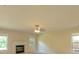 Bright living room with a fireplace, neutral walls, and ample natural light from the windows at 1336 Nathan Mauldin Dr, Lawrenceville, GA 30043