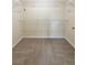 Spacious walk-in closet featuring neutral carpeting and multiple tiers of wire shelving for optimal organization at 1336 Nathan Mauldin Dr, Lawrenceville, GA 30043