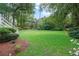 Lush green lawn and garden beds in the backyard of this home, creating a tranquil outdoor space at 2697 N Thompson Ne Rd, Atlanta, GA 30319