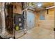 Basement featuring exposed ductwork and pipes, unfinished walls, and mechanical equipment including a furnace at 2697 N Thompson Ne Rd, Atlanta, GA 30319