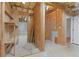 Unfinished basement area with exposed framing, utilities, and a doorway leading to another section at 2697 N Thompson Ne Rd, Atlanta, GA 30319