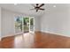 Bright bedroom with hardwood floors and double doors leading to a balcony at 2697 N Thompson Ne Rd, Atlanta, GA 30319