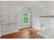 Walk-in closet with hardwood floors, storage racks, and natural light at 2697 N Thompson Ne Rd, Atlanta, GA 30319