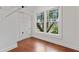 Walk-in closet with hardwood floors, storage racks, and natural light at 2697 N Thompson Ne Rd, Atlanta, GA 30319