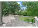 View from the wooden deck showing the backyard with lush greenery and partial view of the home at 2697 N Thompson Ne Rd, Atlanta, GA 30319