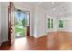 Grand entryway featuring hardwood floors, elegant lighting, and view to landscaped front yard through the open door at 2697 N Thompson Ne Rd, Atlanta, GA 30319