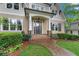 Inviting front porch and beautiful landscaping featuring stone pathway leading up to the front door with brick entryway at 2697 N Thompson Ne Rd, Atlanta, GA 30319