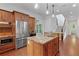 Beautiful kitchen with stainless steel appliances, wood cabinets, and granite countertops on the island at 2697 N Thompson Ne Rd, Atlanta, GA 30319