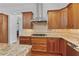 Gourmet kitchen with stainless steel hood vent, custom cabinets, gas cooktop and tile backsplash at 2697 N Thompson Ne Rd, Atlanta, GA 30319