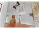 Bright living room with vaulted ceilings, fireplace, and access to both a porch and staircase at 2697 N Thompson Ne Rd, Atlanta, GA 30319