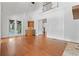 Living room featuring hardwood floors, fireplace, barn doors, and access to the porch at 2697 N Thompson Ne Rd, Atlanta, GA 30319