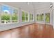 Bright living room featuring a wall of windows and an access door to the porch at 2697 N Thompson Ne Rd, Atlanta, GA 30319