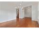 Living room featuring hardwood floors, recessed lighting, a chandelier and entryways into other rooms at 2697 N Thompson Ne Rd, Atlanta, GA 30319
