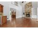 Spacious living room with stone fireplace and an adjoining bar area at 2697 N Thompson Ne Rd, Atlanta, GA 30319
