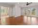 Main bedroom featuring hardwood floors, vaulted ceilings, and an attached bathroom with soaking tub at 2697 N Thompson Ne Rd, Atlanta, GA 30319