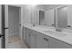 Modern bathroom with double sink vanity, sleek countertops, and neutral color palette at 4830 Briscoe Dr, Cumming, GA 30028