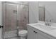 Bathroom with tiled shower and modern vanity at 4830 Briscoe Dr, Cumming, GA 30028