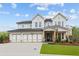 Beautiful three-car garage home with manicured lawn and craftsman style columns at 4830 Briscoe Dr, Cumming, GA 30028