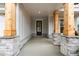 Covered front porch with stone supports and wooden columns at 4830 Briscoe Dr, Cumming, GA 30028